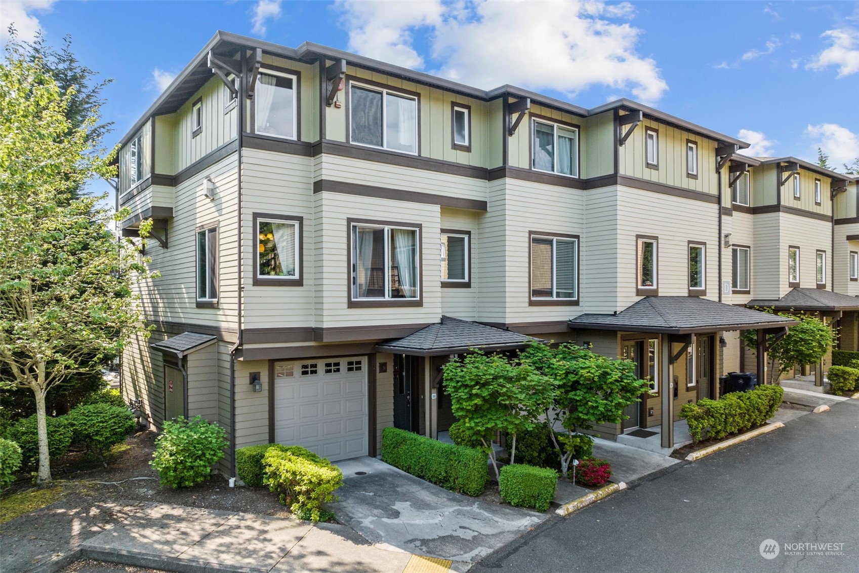 a front view of a building with garden