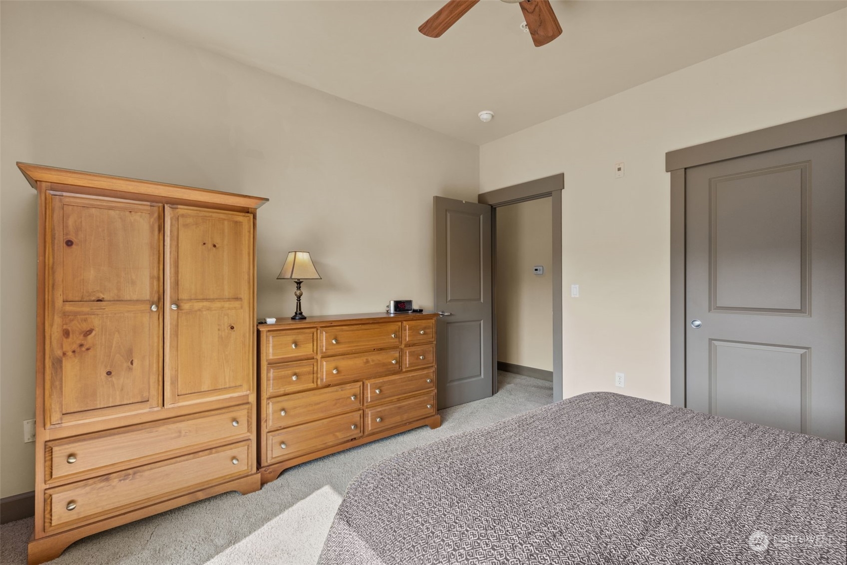 2115 201st Place Southeast, Unit D1 Bothell, WA 98012 - Photo 16 of 33 a bedroom with a bed and cabinets