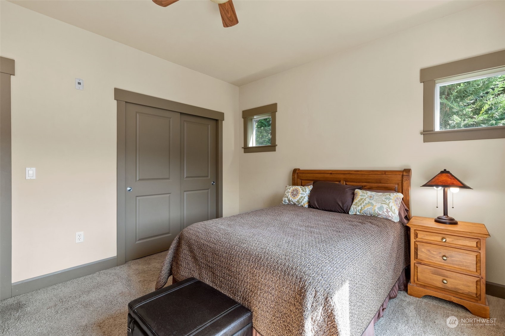2115 201st Place Southeast, Unit D1 Bothell, WA 98012 - Photo 17 of 33 a bedroom with a bed and a cabinets
