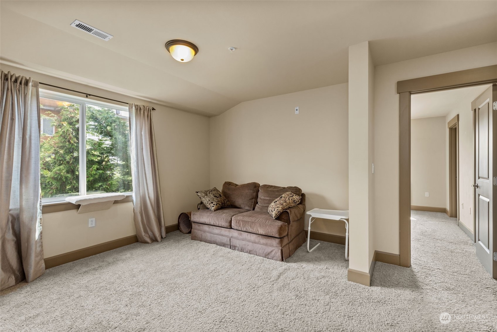2115 201st Place Southeast, Unit D1 Bothell, WA 98012 - Photo 20 of 33 a living room with furniture and a window