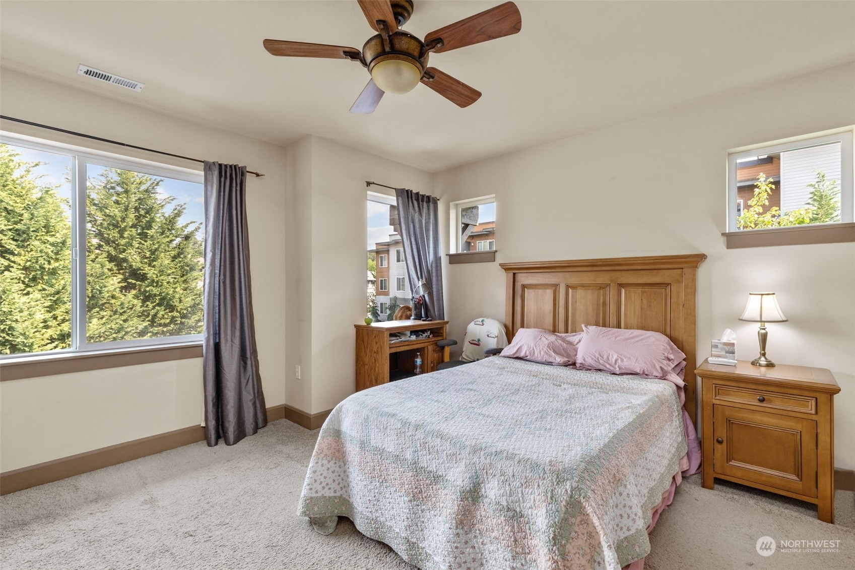 2115 201st Place Southeast, Unit D1 Bothell, WA 98012 - Photo 24 of 33 a bedroom with a bed dresser and a window