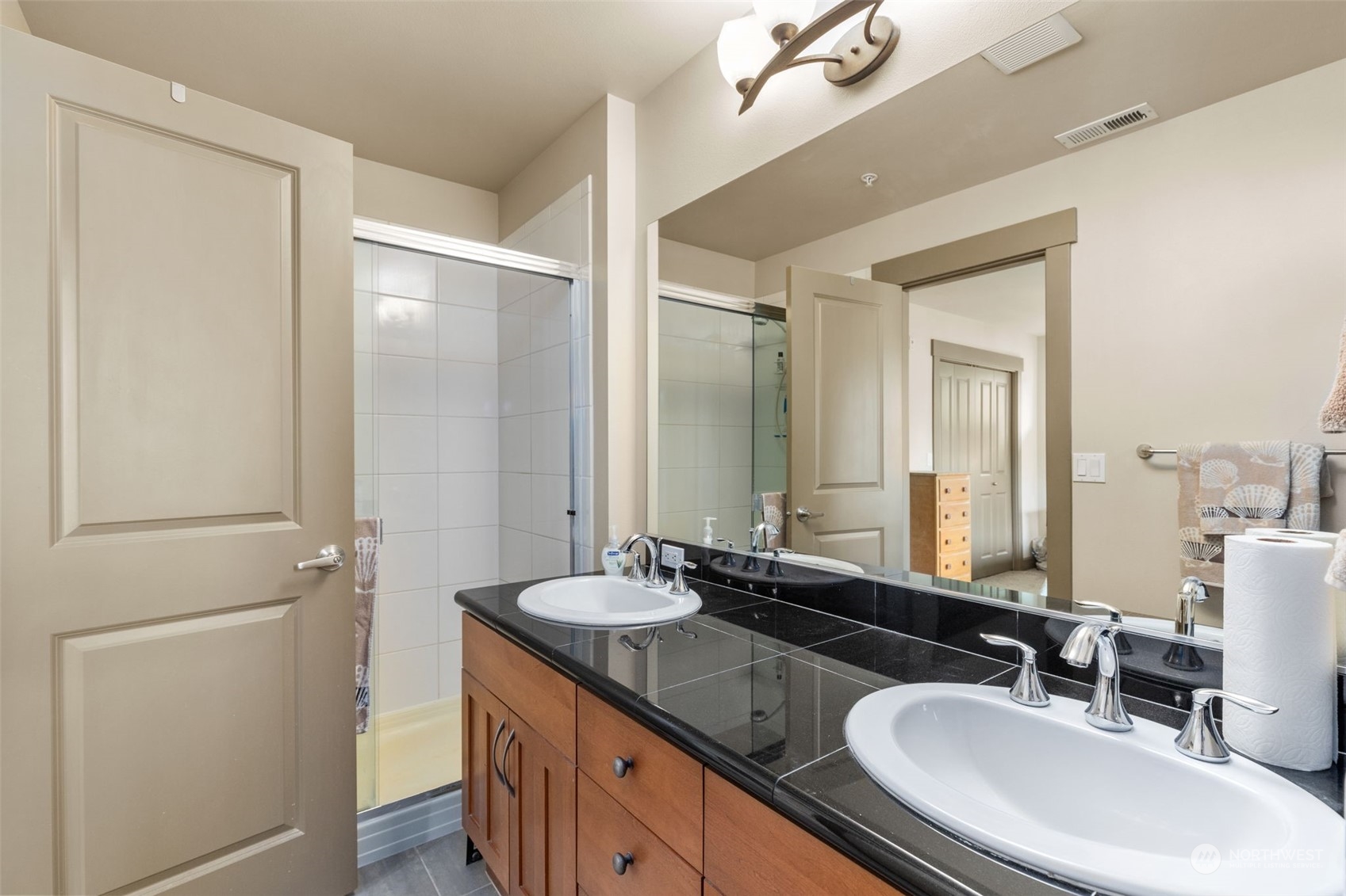 2115 201st Place Southeast, Unit D1 Bothell, WA 98012 - Photo 27 of 33 a bathroom with double sink and a mirror