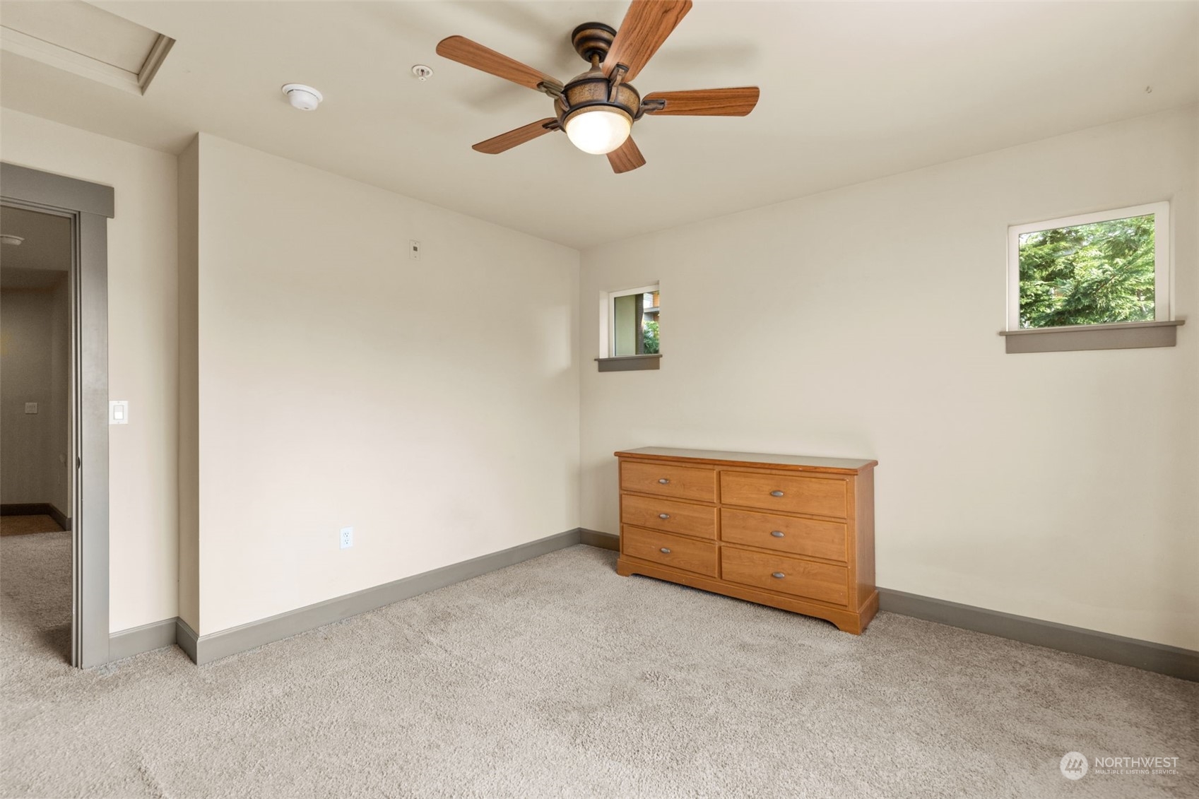 2115 201st Place Southeast, Unit D1 Bothell, WA 98012 - Photo 29 of 33 an empty room with closet and fan