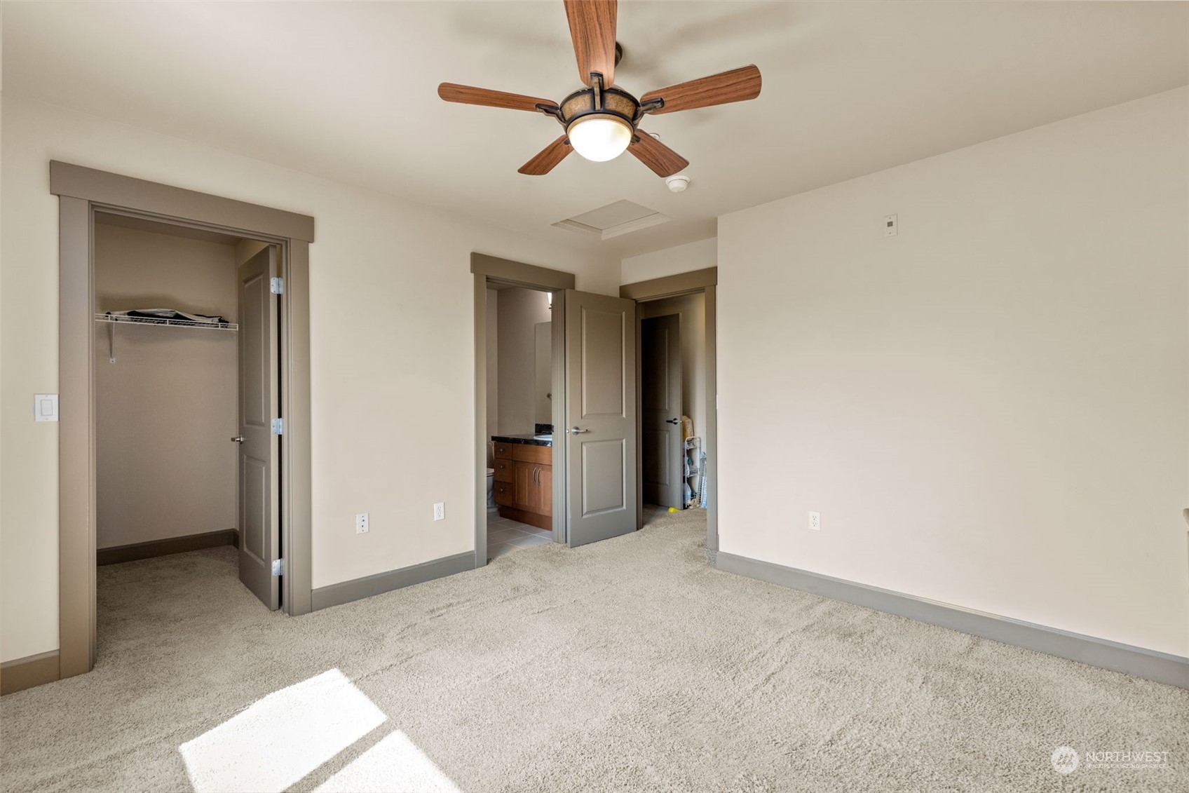 2115 201st Place Southeast, Unit D1 Bothell, WA 98012 - Photo 30 of 33 a view of a room with a ceiling fan and carpet