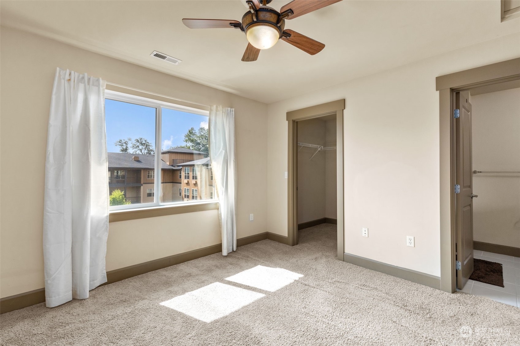 2115 201st Place Southeast, Unit D1 Bothell, WA 98012 - Photo 31 of 33 a view of an empty room with a window