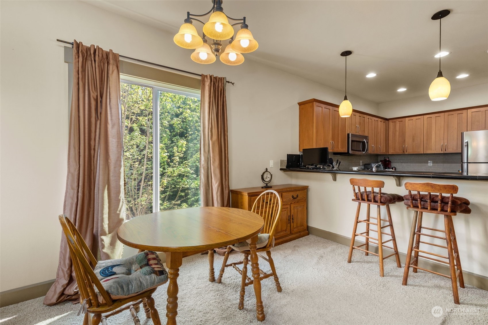 2115 201st Place Southeast, Unit D1 Bothell, WA 98012 - Photo 8 of 33 a view of a dining room with furniture window and outside view