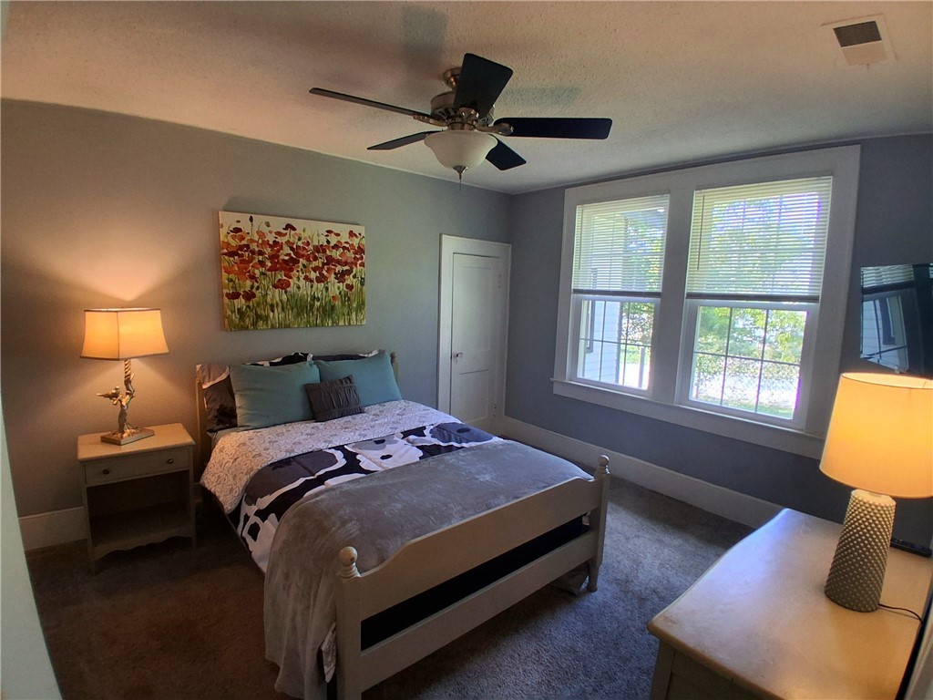 506 Pinckney Street Greenville, SC 29601 - Photo 22 of 29 Bright 3rd bedroom with large windows, queen bed, fresh linens, and cozy décor.