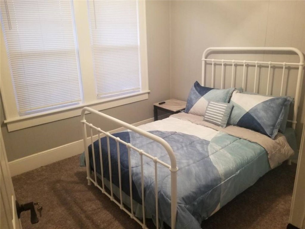 506 Pinckney Street Greenville, SC 29601 - Photo 24 of 29 3rd bedroom with cozy furnishings and closet space.