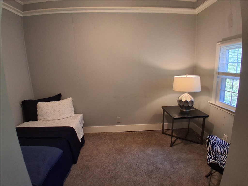 506 Pinckney Street Greenville, SC 29601 - Photo 26 of 29 Additional bedroom with twin bed, cozy décor, and plenty of versatility for guests or an office.