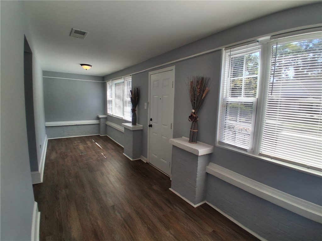 506 Pinckney Street Greenville, SC 29601 - Photo 3 of 29 Versatile sunroom with plenty of natural light—ideal for a reading nook, office, or play space.”