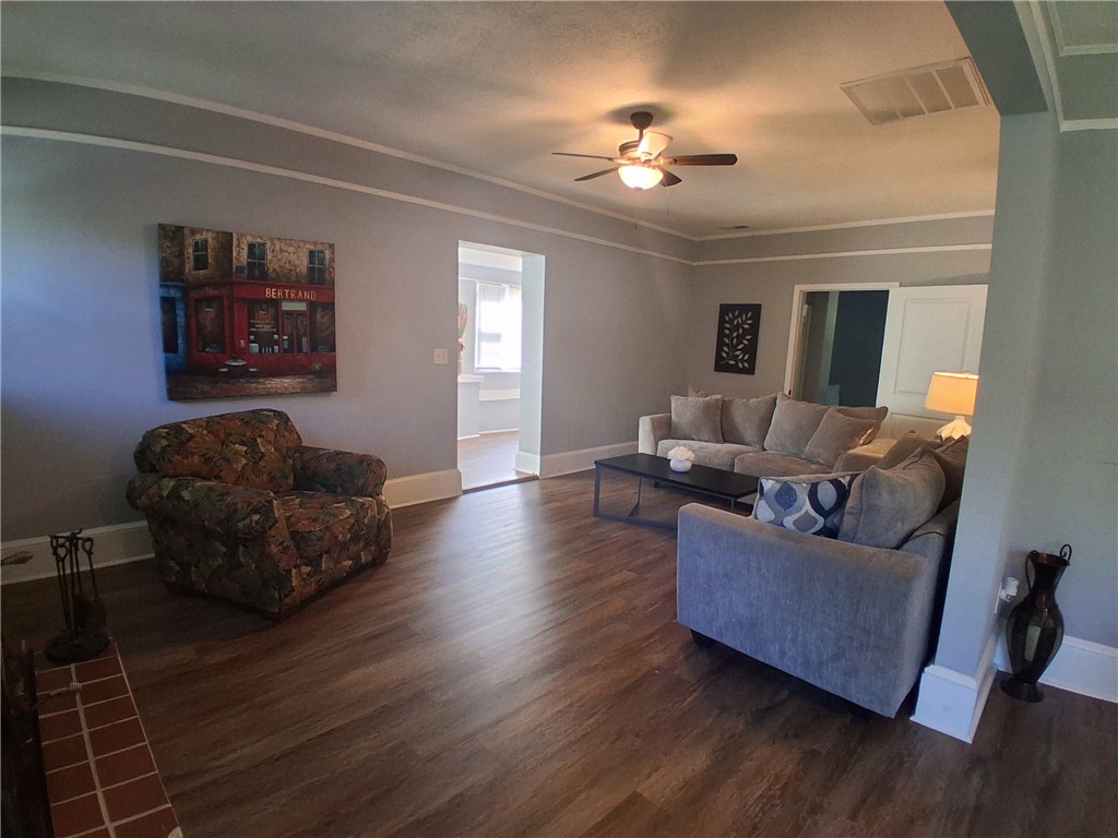 506 Pinckney Street Greenville, SC 29601 - Photo 5 of 29 Comfortable living room with cozy seating, ceiling fan, and inviting layout for relaxation.
