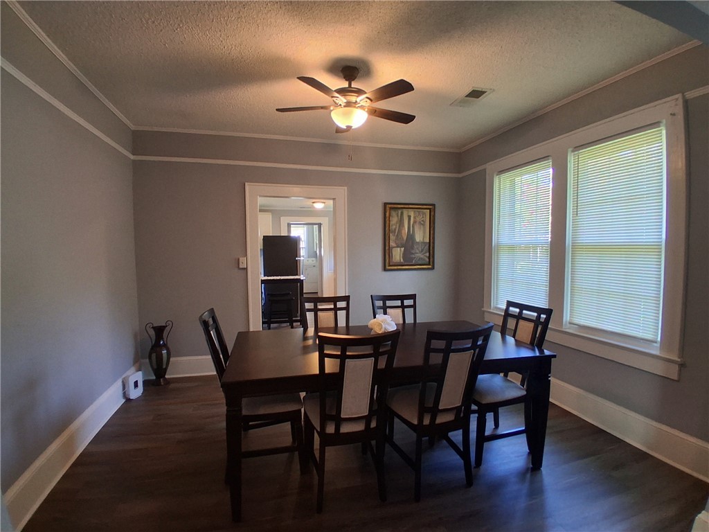 506 Pinckney Street Greenville, SC 29601 - Photo 9 of 29 Spacious dining area with seating for six, open to the living room — perfect for meals or entertaining