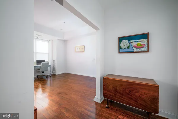 a living room with furniture and a chair