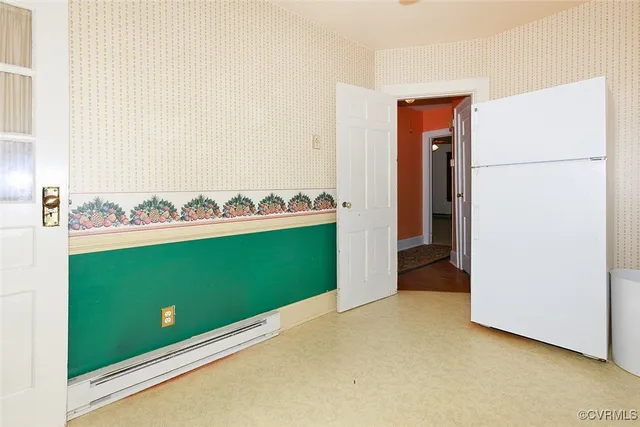 a view of a kitchen with a refrigerator and stove