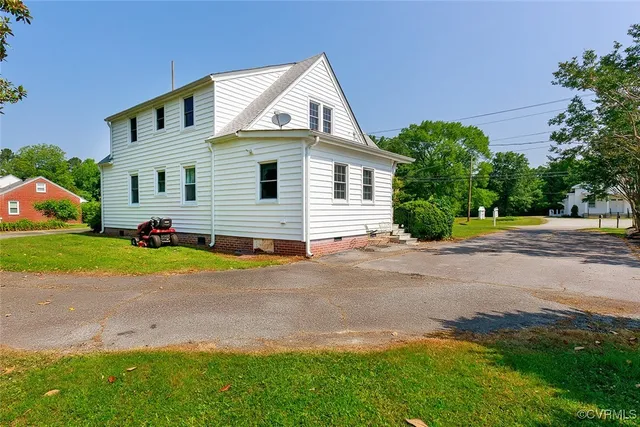 a view of a park with large trees