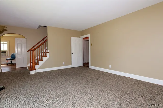 a view of an empty room with windows