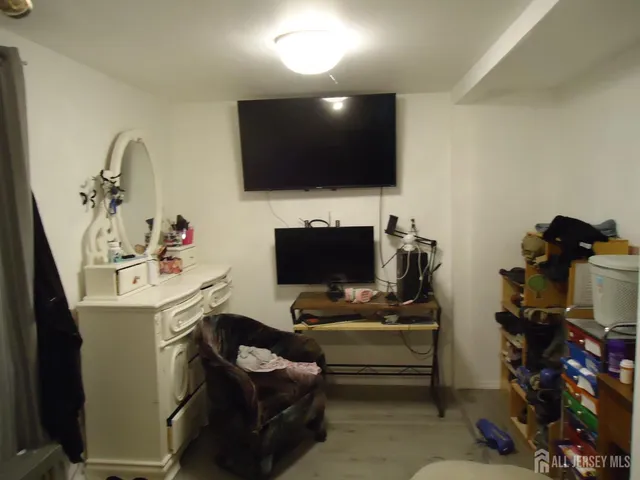 a room with furniture and a flat screen tv