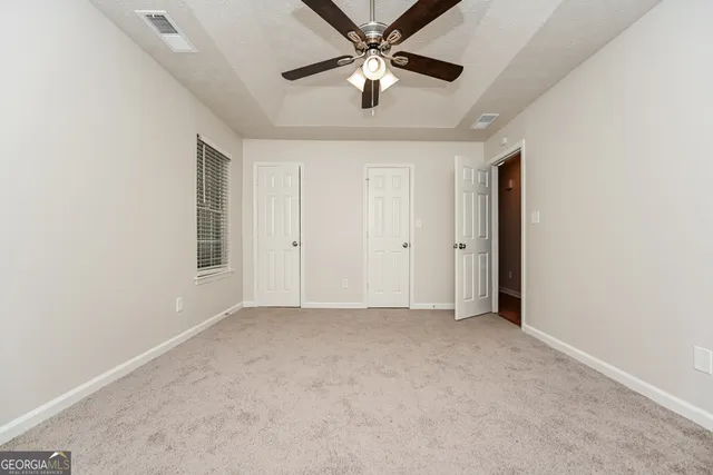 an empty room with windows