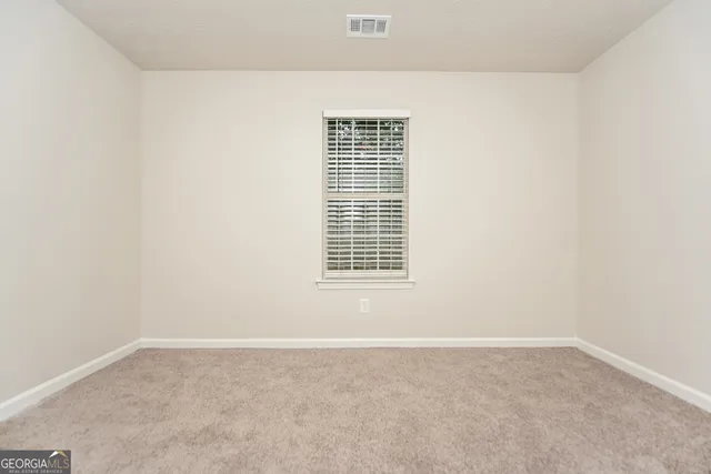 a view of a room that has a window in it