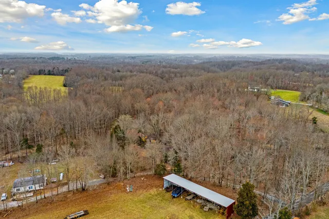a aerial view of a house with a yard