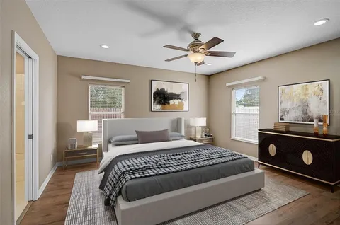 a bedroom with a bed and a window