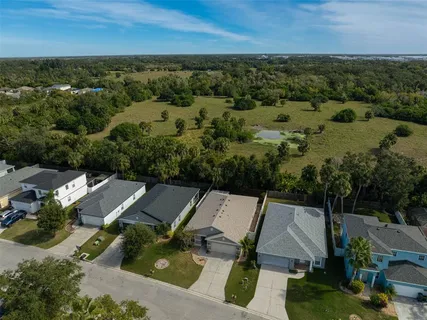 a aerial view of a house with yard