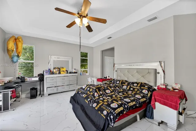 a bed room with furniture and a window