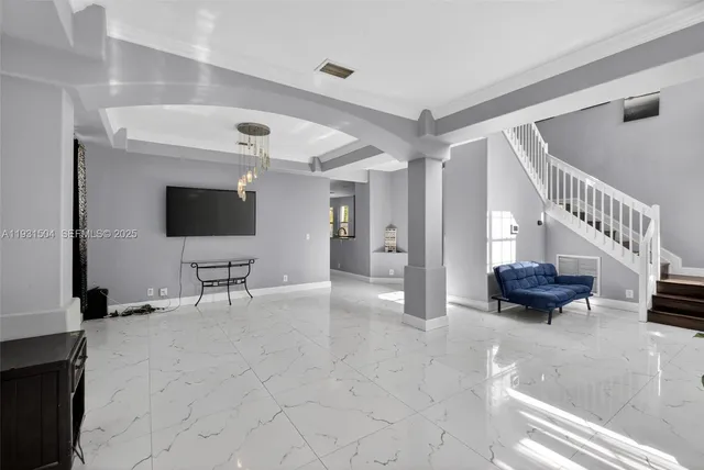 a view of livingroom with furniture and a flat screen tv