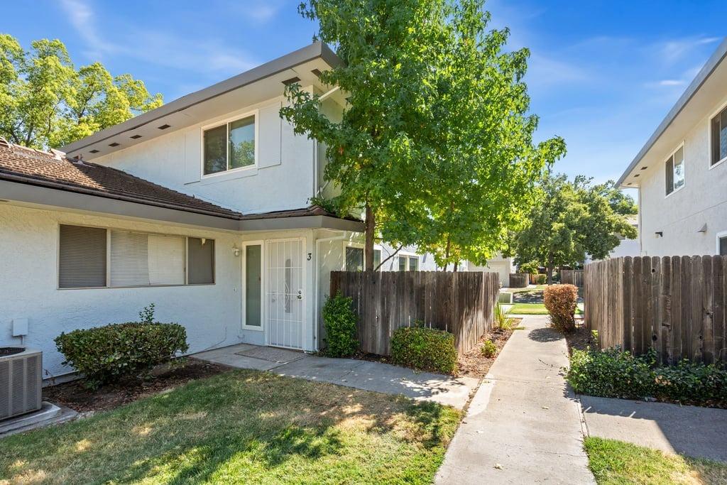 5604 Walerga Road, Unit 3 Sacramento, CA 95842 - Photo 1 of 1 a view of a house with a yard and plants