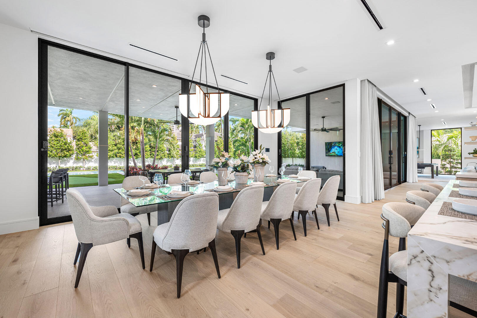 481 Thatch Palm Drive Boca Raton, FL 33432 - Photo 21 of 98 a view of a dining room with furniture window and wooden floor