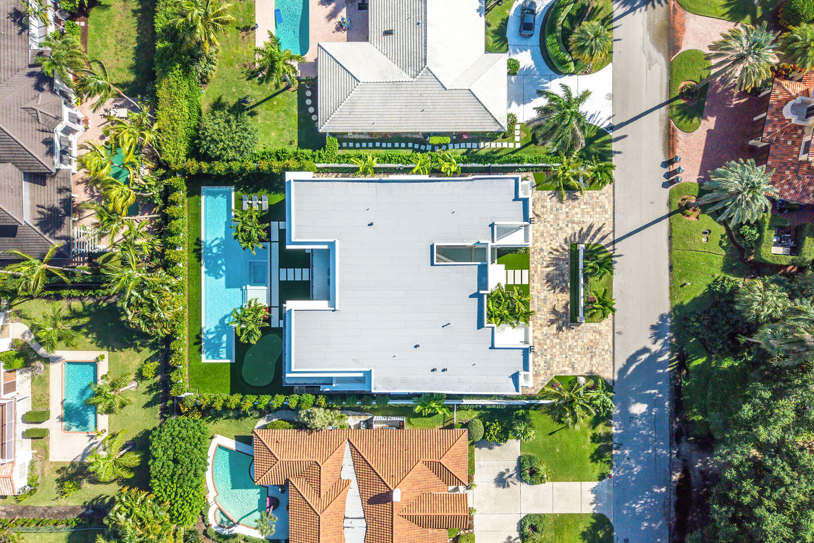 481 Thatch Palm Drive Boca Raton, FL 33432 - Photo 23 of 98 an aerial view of a house with a yard and garden