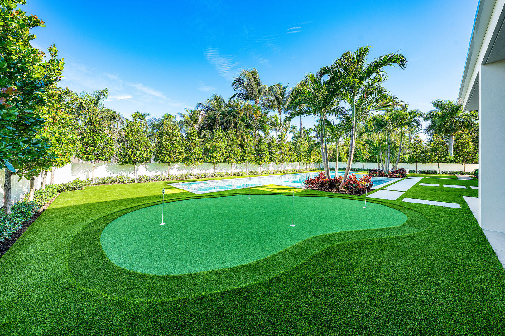 481 Thatch Palm Drive Boca Raton, FL 33432 - Photo 34 of 98 a view of a golf course with a lake