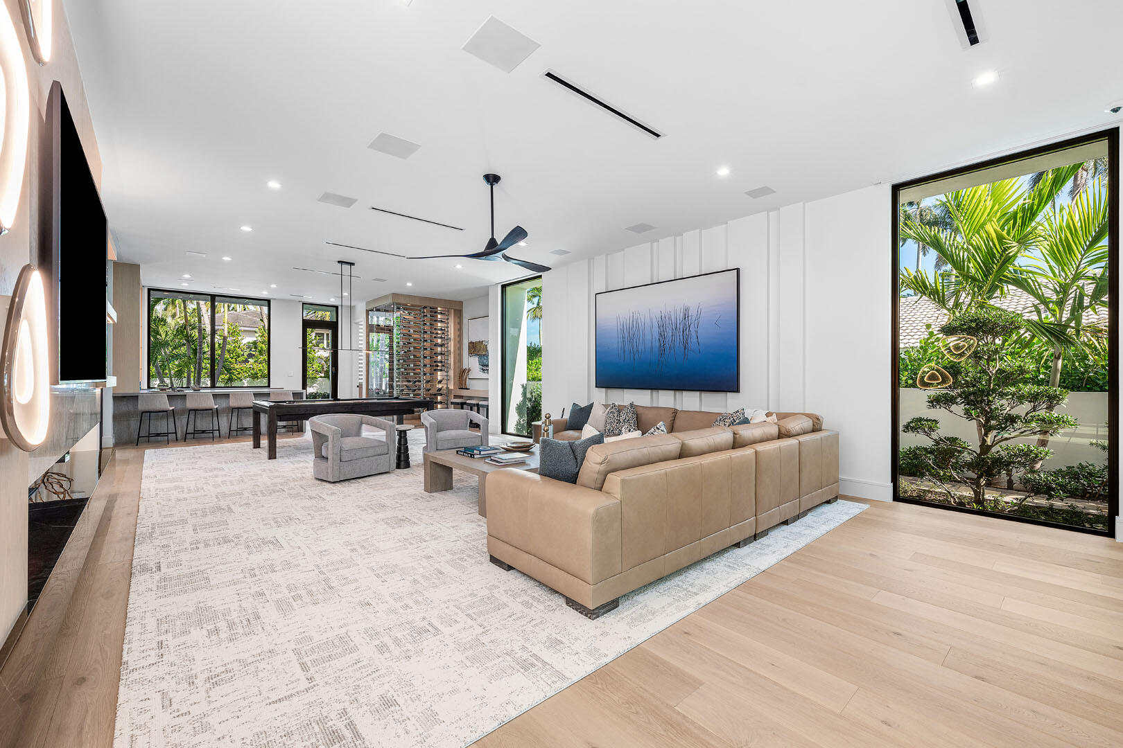 481 Thatch Palm Drive Boca Raton, FL 33432 - Photo 36 of 98 a living room with furniture large window and wooden floor