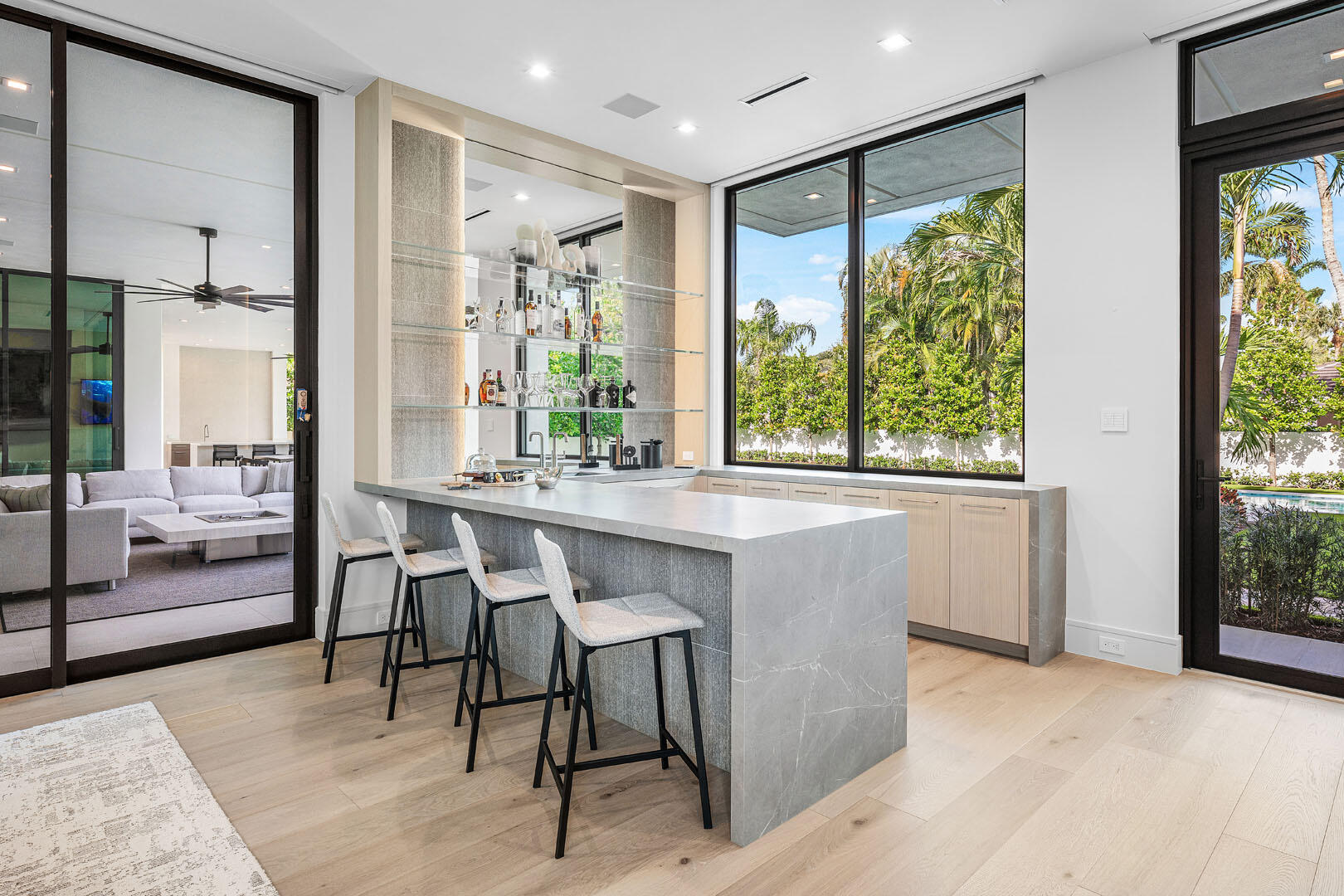481 Thatch Palm Drive Boca Raton, FL 33432 - Photo 42 of 98 a dining room with stainless steel appliances granite countertop furniture and a large window