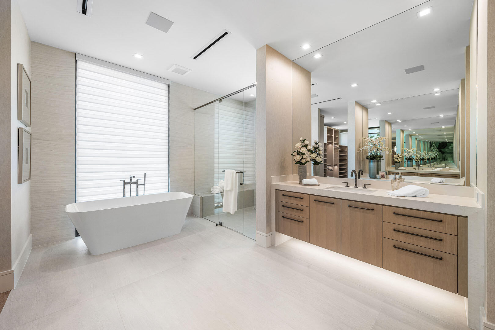 481 Thatch Palm Drive Boca Raton, FL 33432 - Photo 64 of 98 a large bathroom with a large tub sink vanity granite and a shower