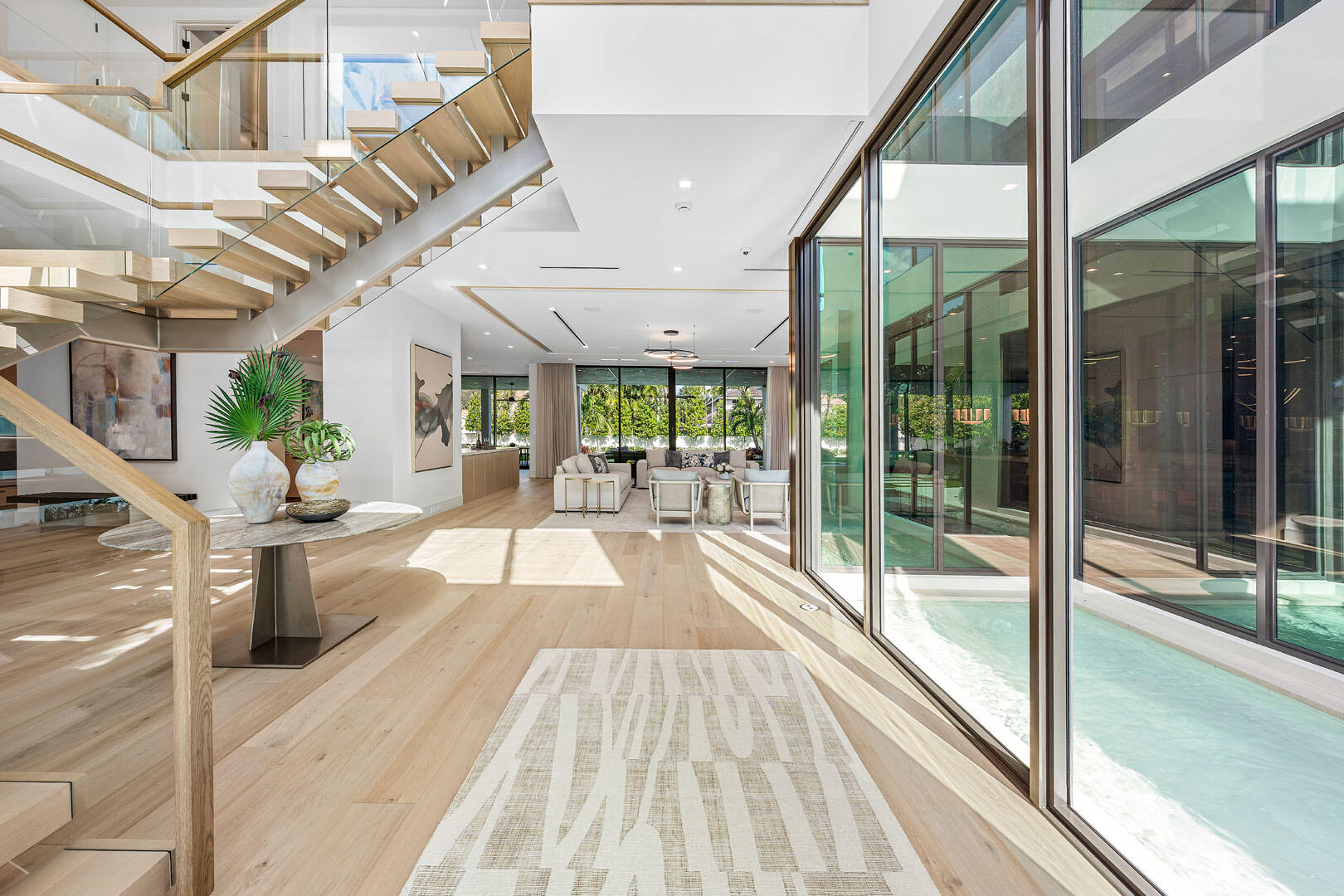481 Thatch Palm Drive Boca Raton, FL 33432 - Photo 8 of 98 a view of a patio with wooden floor and iron stairs