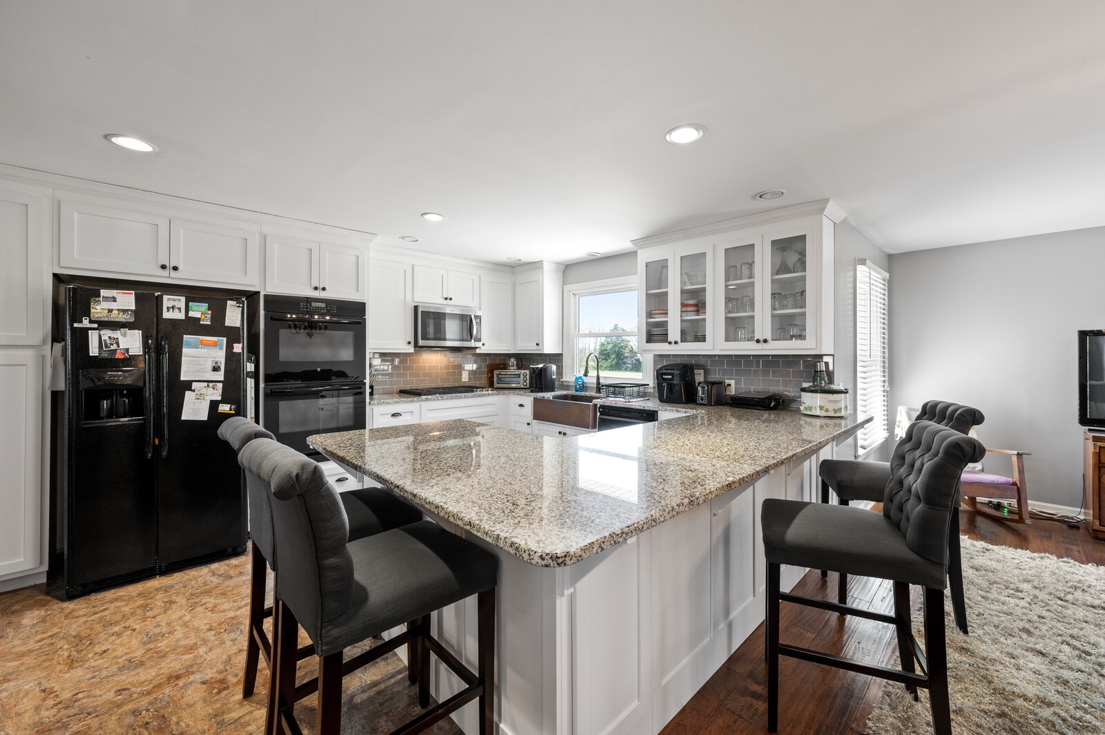 6574 Franklin Road Lebanon, TN 37090 - Photo 5 of 18 a kitchen with stainless steel appliances granite countertop a table chairs and a refrigerator