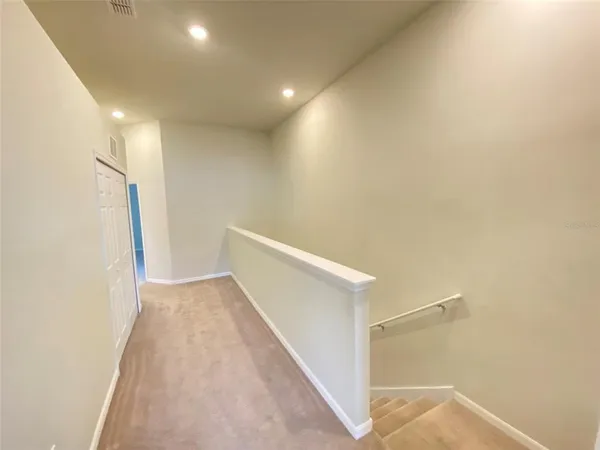 a view of hallway with stairs