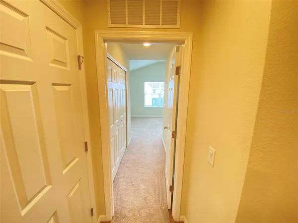 a view of a bathroom from a hallway