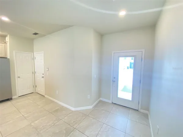 a view of an empty room and window