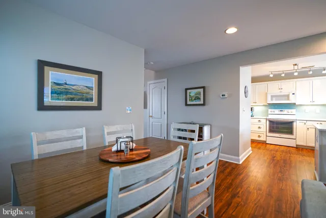 a room with dining table and chairs