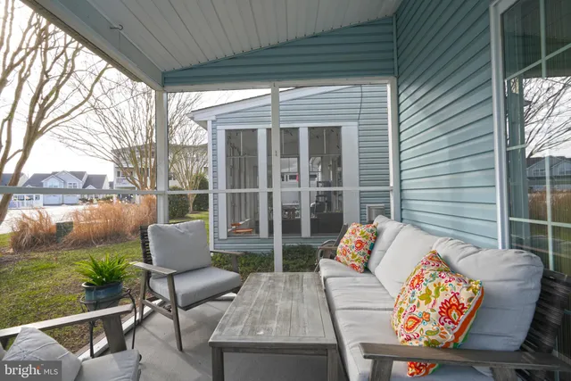 a outdoor living space with patio furniture and a potted plant