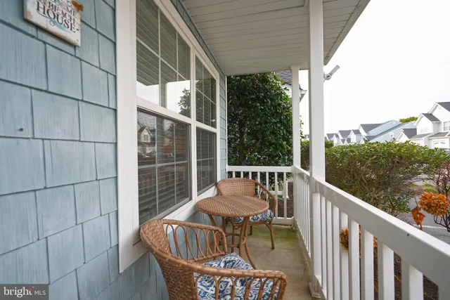a view of a chair and table in the balcony