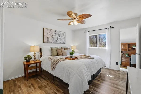 a bedroom with bed and a window