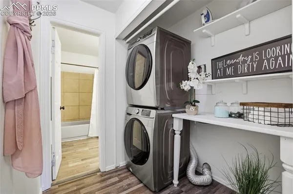 a close view of a utility room with dryer and washer
