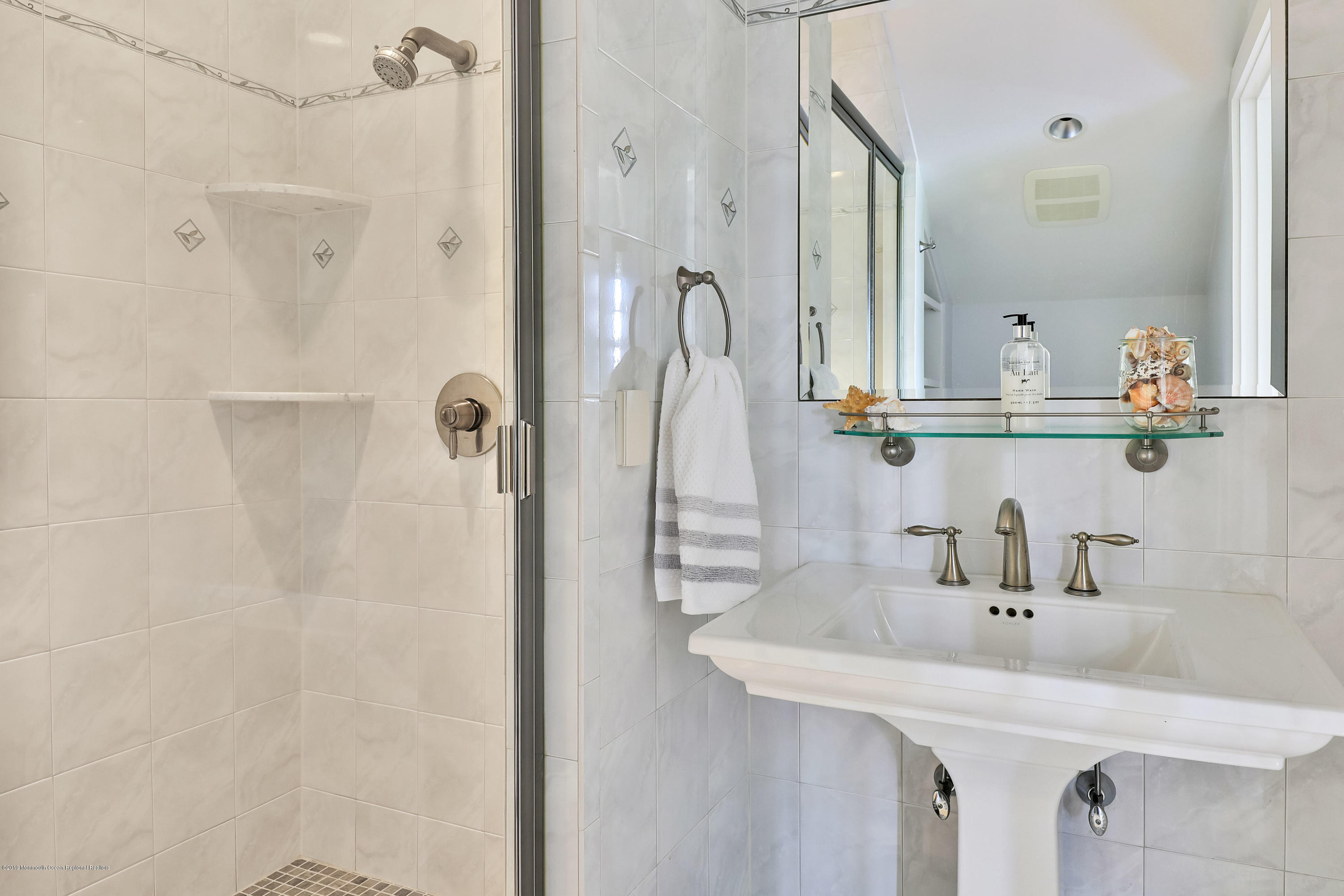3 Harbor Drive Rumson, NJ 07760 - Photo 20 of 29 a bathroom with a sink and mirror