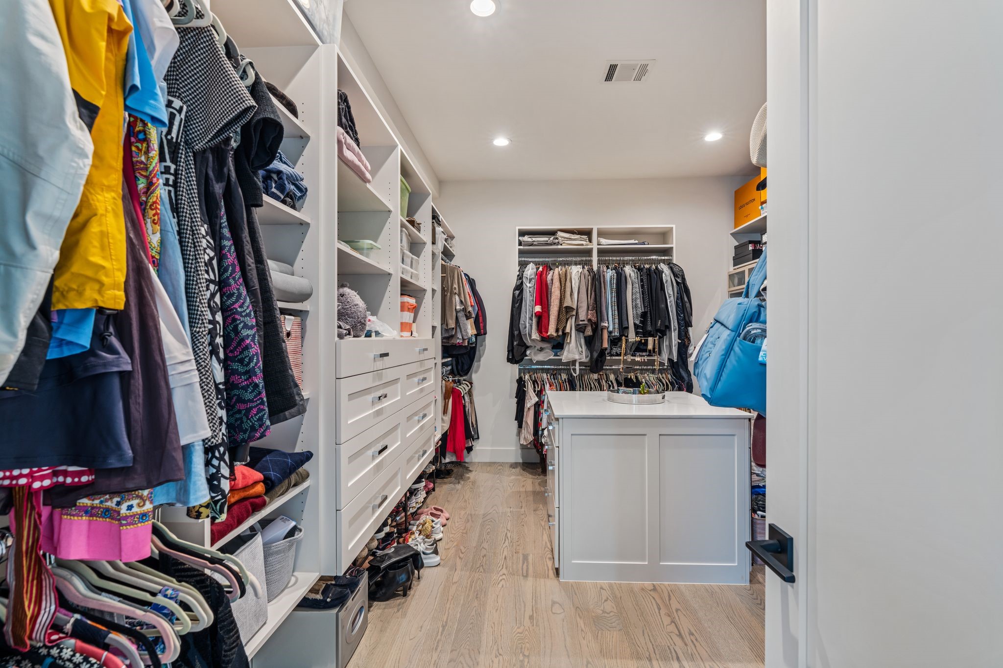 4638 Merwin Street Houston, TX 77027 - Photo 22 of 42 The custom designed walk-in closet features built in custom cabinetry offering extensive storage and organization.