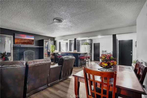 a living room with fireplace furniture and a flat screen tv