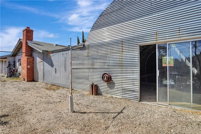 a view of a house with a yard and garage