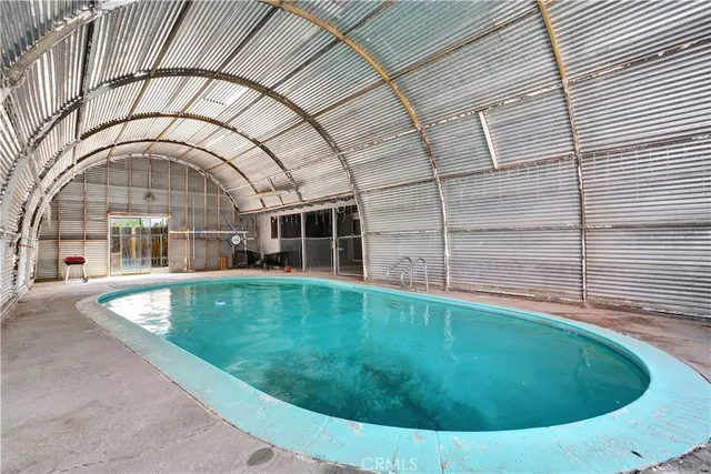 a view of a swimming pool with a patio